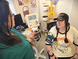 A nurse takes a client's blood pressure at DESC's STAR Center.